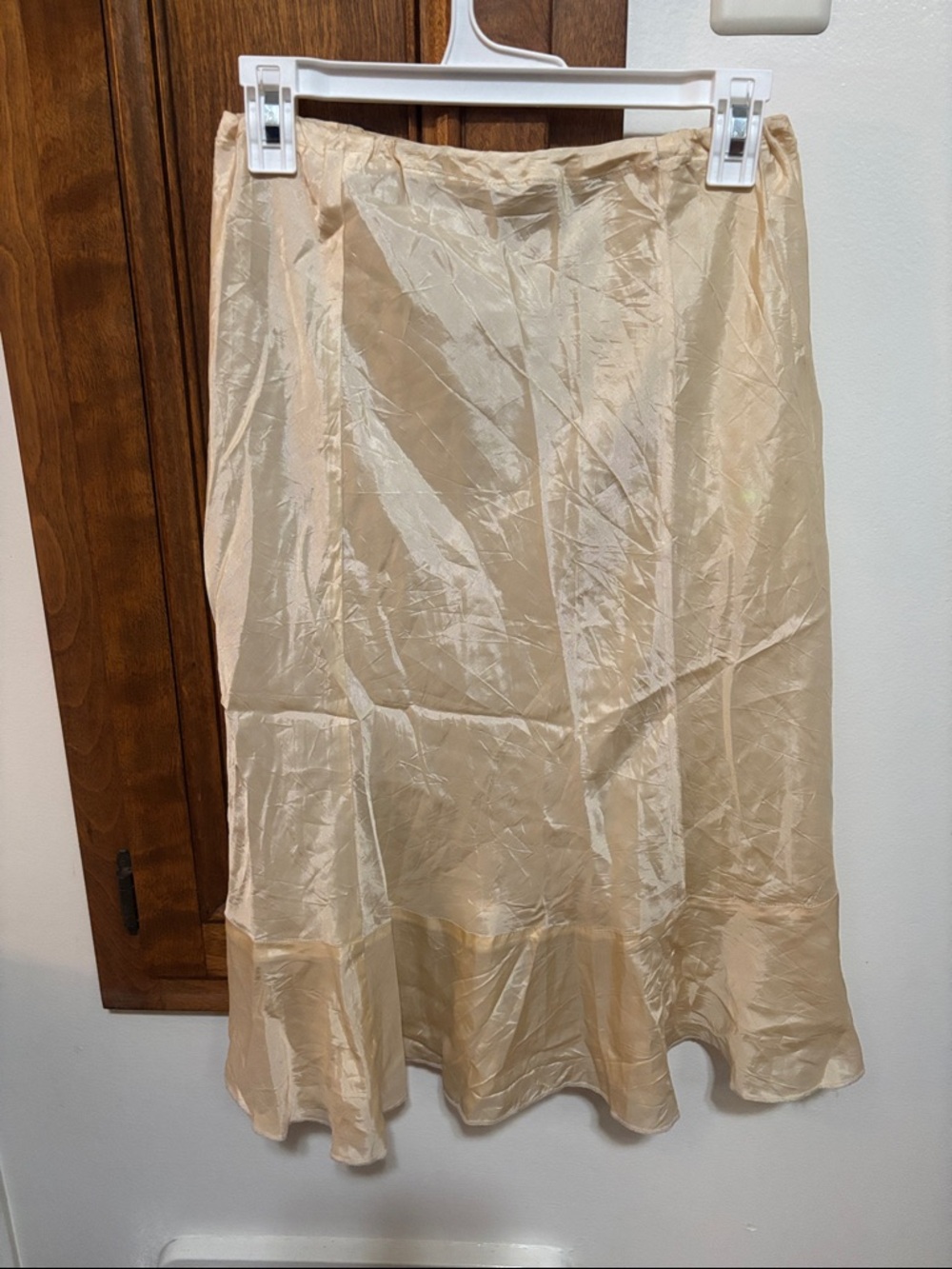 Clara Collin’s Paris Cream Satin Midi Skirt with Flared Hem